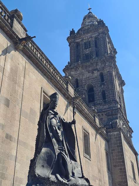 Cathedral's tower and Pope John Paul key statue.