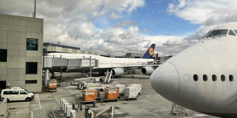 Two Boeing 747 planes viewed from a boarding gate at terminal 1 Mexico City Benito Juárez Airport.